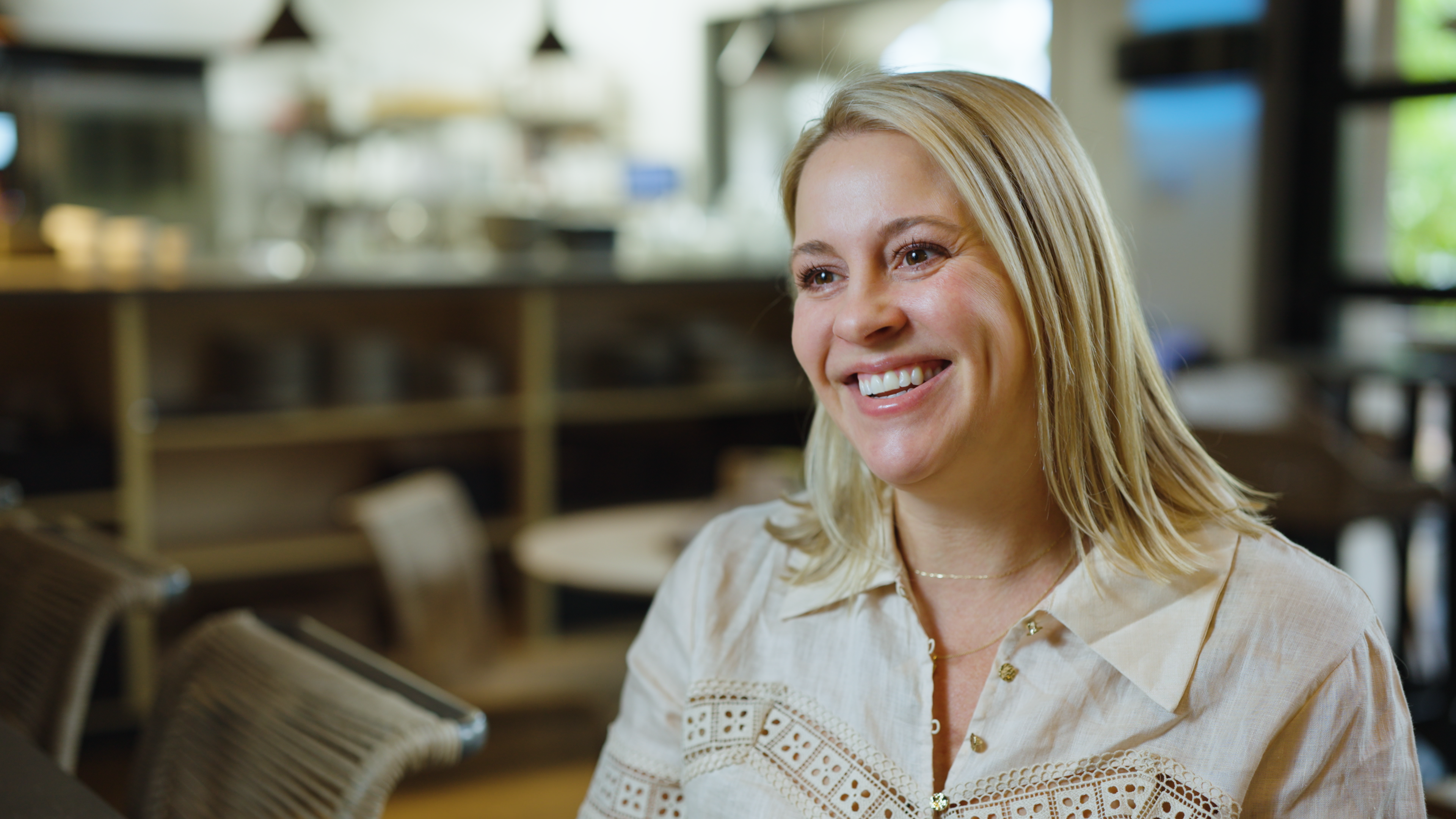 Woman smiling in a casual setting