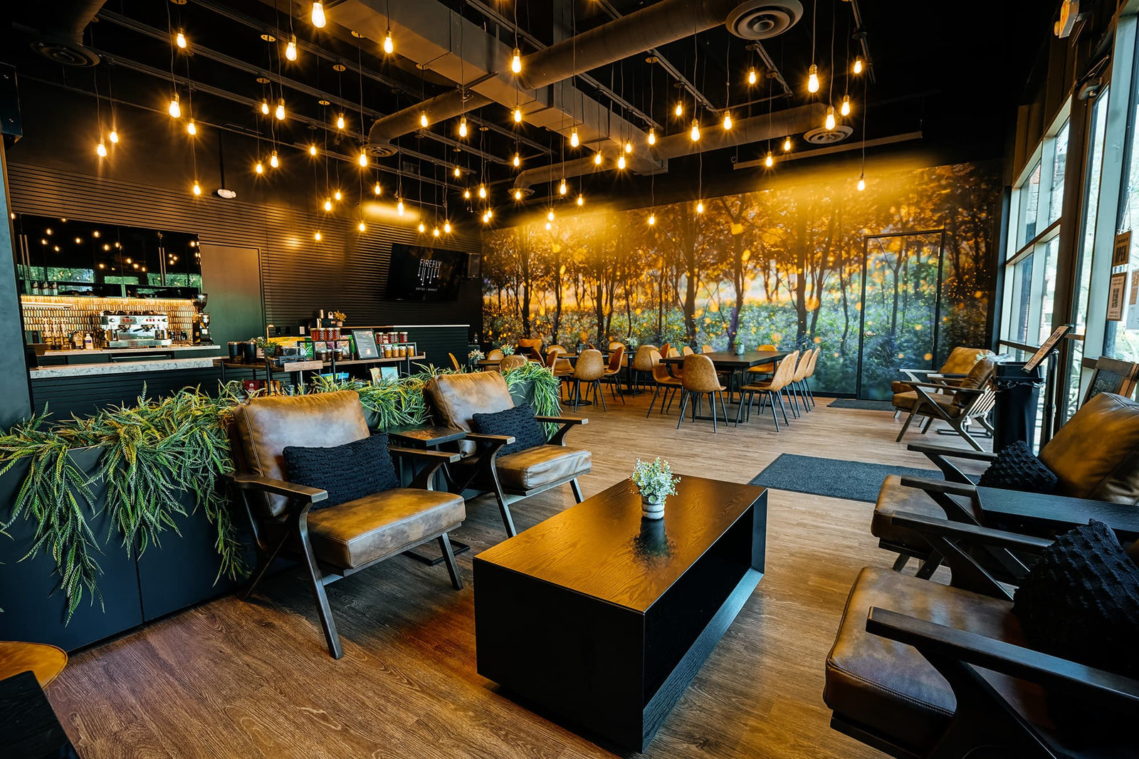 Modern interior of a restaurant with wooden furniture and decorative elements.