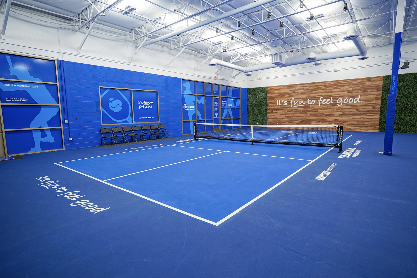 Seats near the left side of the Orchard Pickle Ball Courts