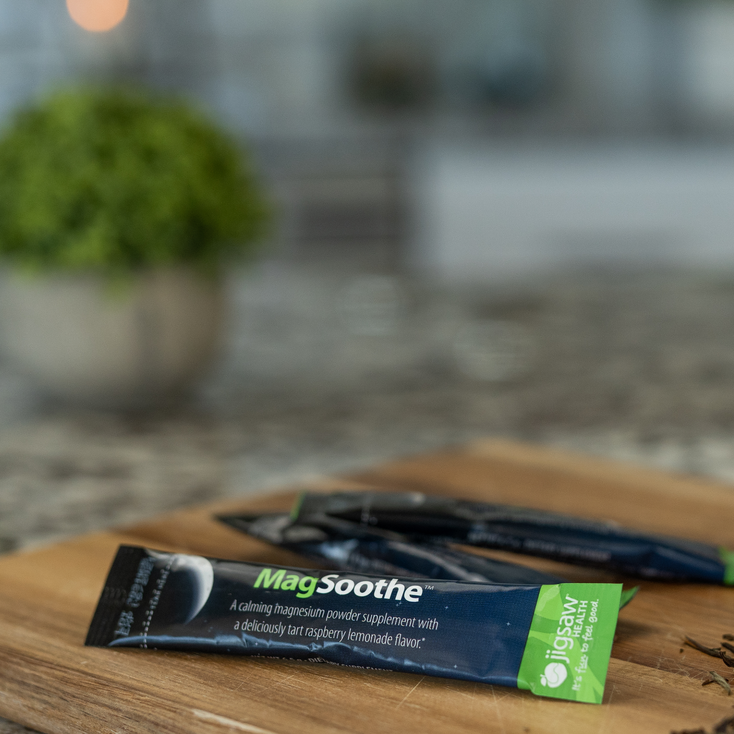 MagSoothe supplement package on a wooden surface with a blurred background