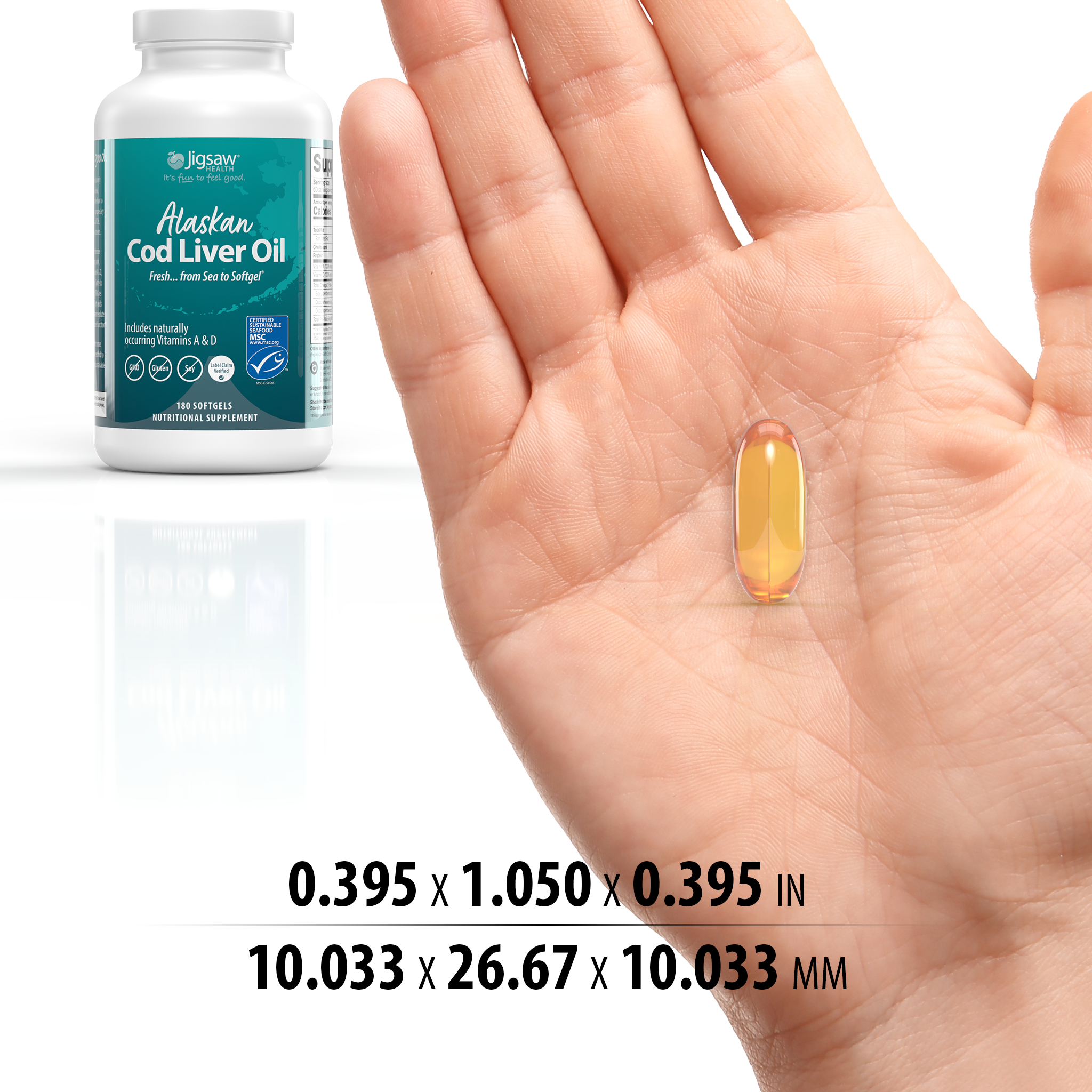 Hand holding a supplement capsule with a bottle labeled 'Alaskan Cod Liver Oil' in the background.