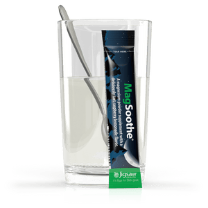 Jigsaw MagSoothe packet next to a glass of water