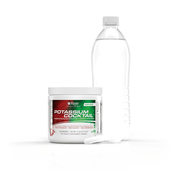 Potassium supplement powder container and water bottle on a reflective surface with a white background